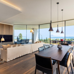 Open-plan living area with floor-to-ceiling windows at Villa Belvedere