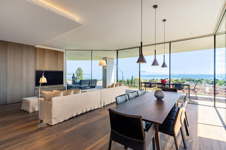 Open-plan living area with floor-to-ceiling windows at Villa Belvedere