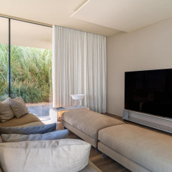 TV room at Villa Belvedere with large screen and comfortable seating