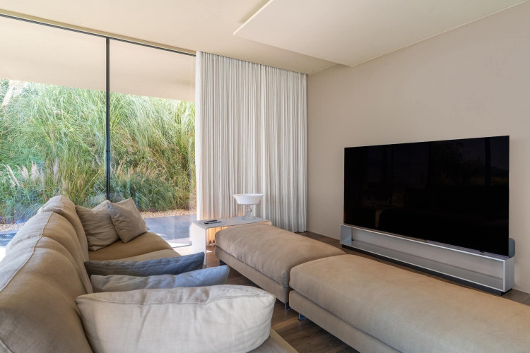 TV room at Villa Belvedere with large screen and comfortable seating