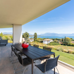 Main terrace at Villa Belvedere with large dining table and lake view