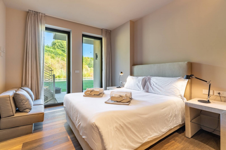 Bedroom at Villa Belvedere with view over the garden