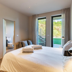 Bedroom at Villa Belvedere with balcony and partial lake view