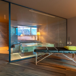 Wellness room at Villa Belvedere with relaxation beds and soft lighting