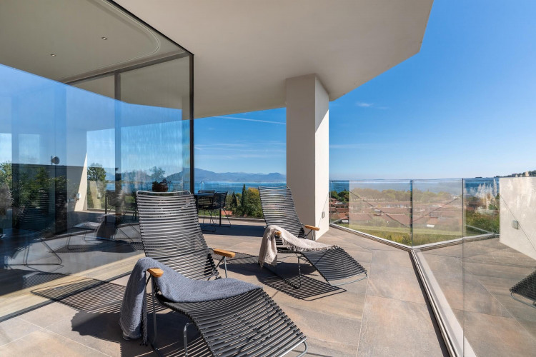 Terrace area at Villa Belvedere with loungers and lake view