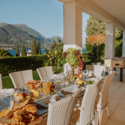 Dining area under the porch at Villa Preone, Lake Garda