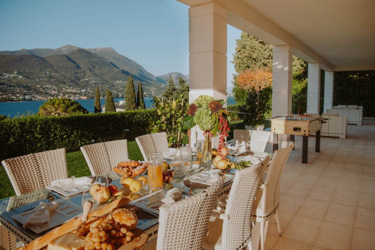Dining area under the porch at Villa Preone, Lake Garda