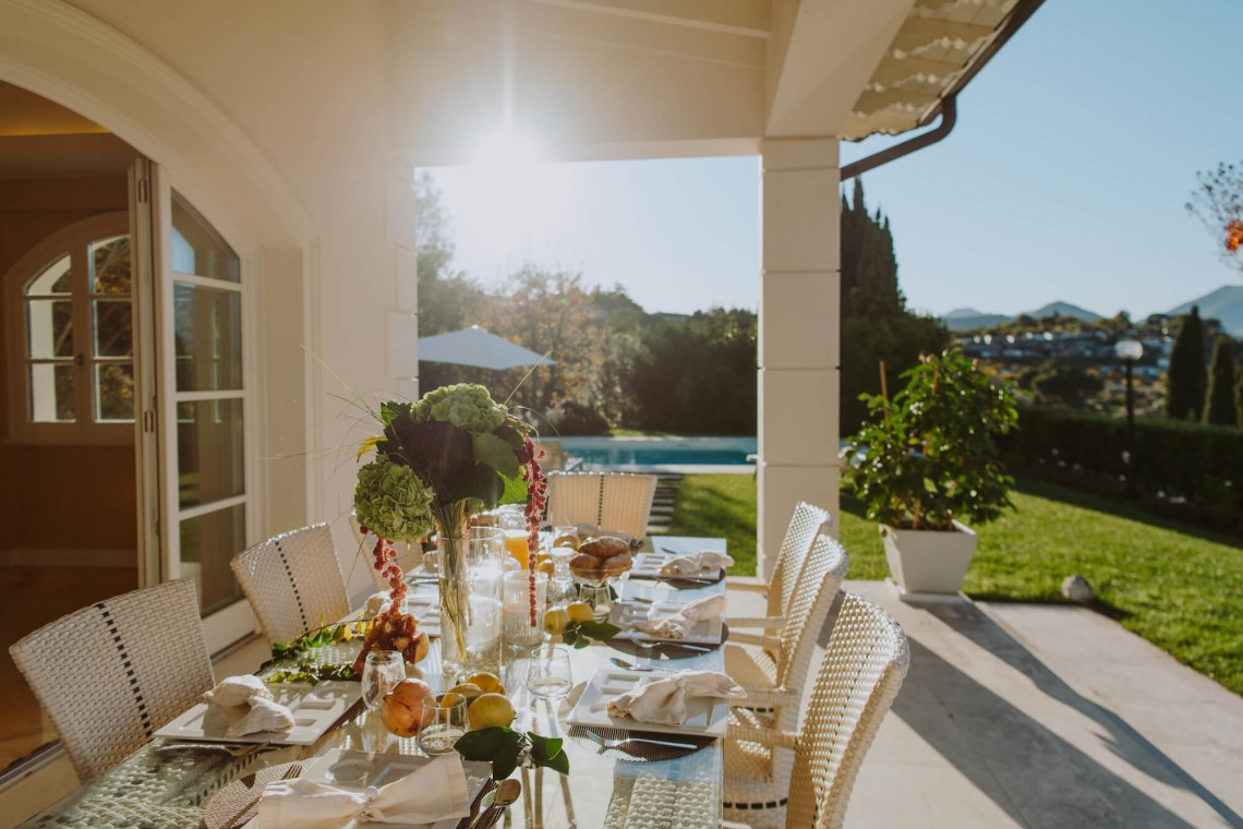 Dining area with panoramic lake views at Villa Preone, Lake Garda