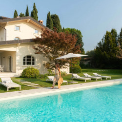 Private outdoor pool at Villa Preone, Lake Garda, surrounded by gardens