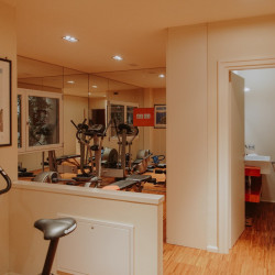 Modern gym at Villa Preone, Lake Garda, with fitness equipment