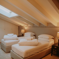 Modern twin bedroom at Villa Preone, Lake Garda villa rental